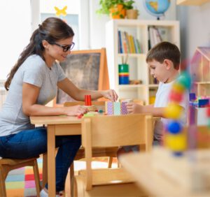 Teacher working with a child